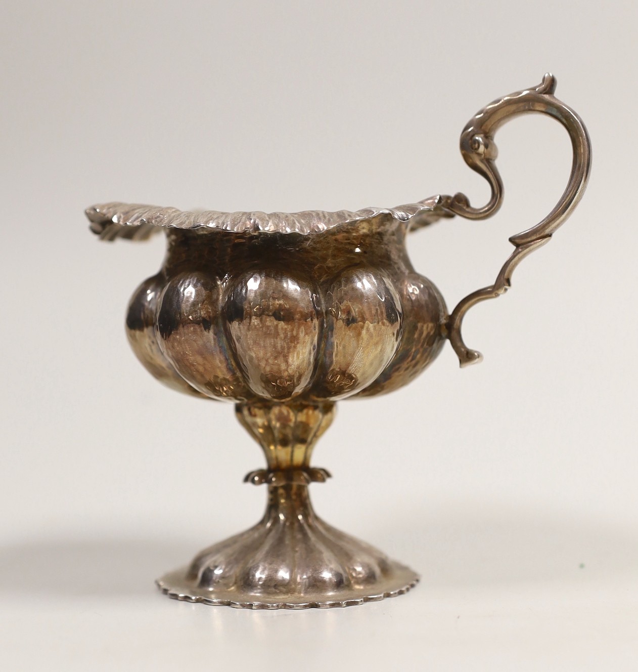 An Edwardian lobed silver pedestal cream jug, Leopold Ltd, London, 1908, 12cm, 5.2oz.